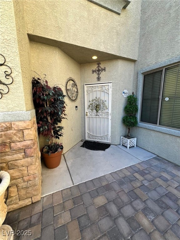 property entrance with a patio area