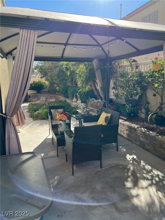 view of patio with a gazebo and outdoor lounge area