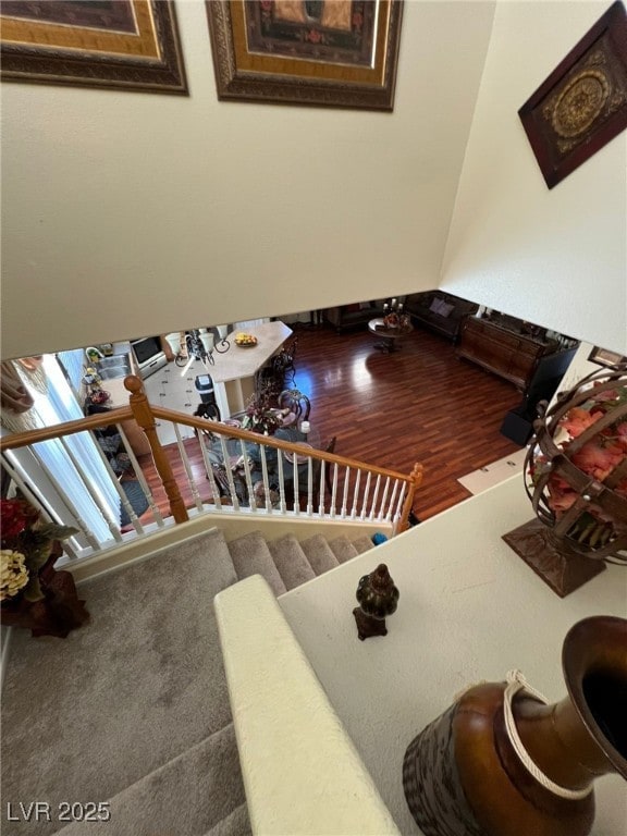 staircase featuring wood-type flooring