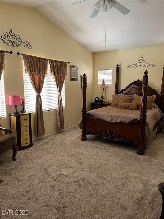 carpeted bedroom with ceiling fan and vaulted ceiling