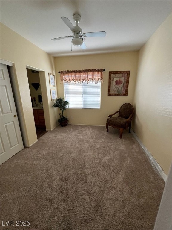 unfurnished room with ceiling fan and carpet floors