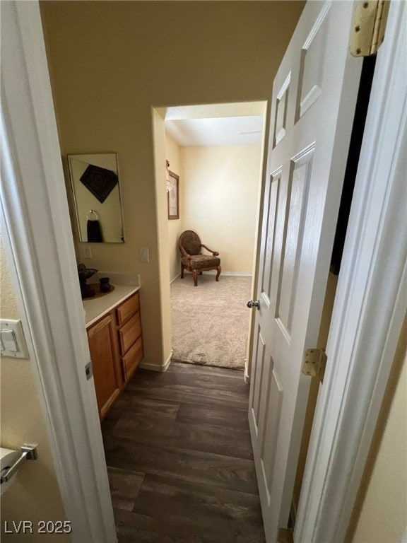 corridor with dark hardwood / wood-style floors