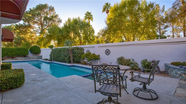 view of swimming pool with a patio area