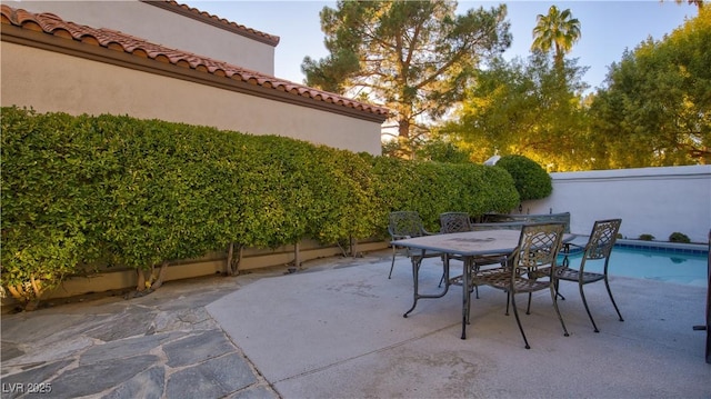 view of patio / terrace featuring a fenced in pool