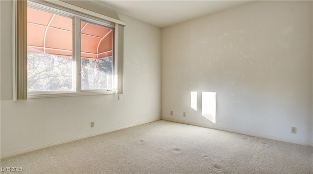 empty room featuring light carpet