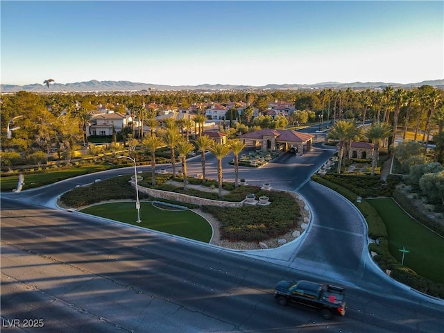 birds eye view of property with a mountain view