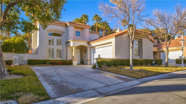 mediterranean / spanish-style house with a garage