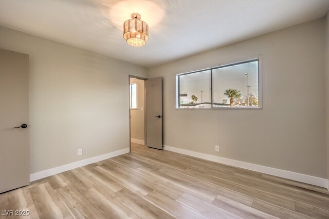 empty room with a healthy amount of sunlight and light wood-type flooring