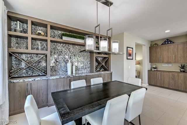 dining area featuring light tile patterned floors