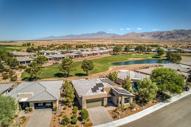 birds eye view of property featuring a water and mountain view