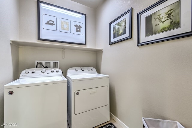 laundry area with washing machine and clothes dryer