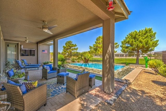 view of patio / terrace featuring ceiling fan, outdoor lounge area, and a fenced in pool