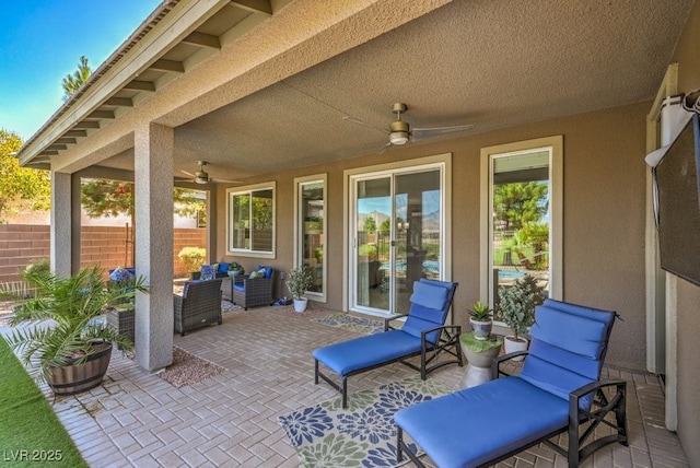 view of patio featuring ceiling fan