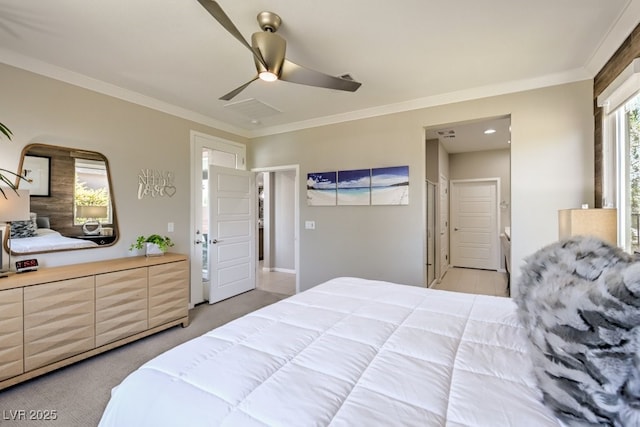 carpeted bedroom featuring ceiling fan and crown molding