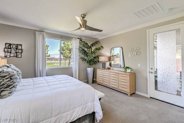 carpeted bedroom with ceiling fan, access to exterior, and ornamental molding