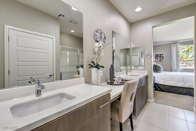 bathroom with vanity, tile patterned flooring, and walk in shower