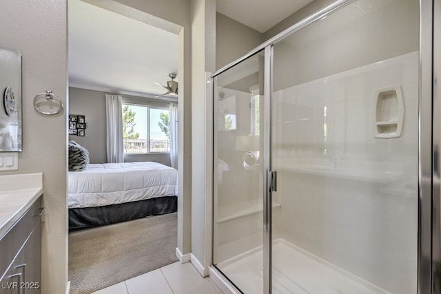 bathroom featuring vanity, ceiling fan, tile patterned floors, and a shower with door