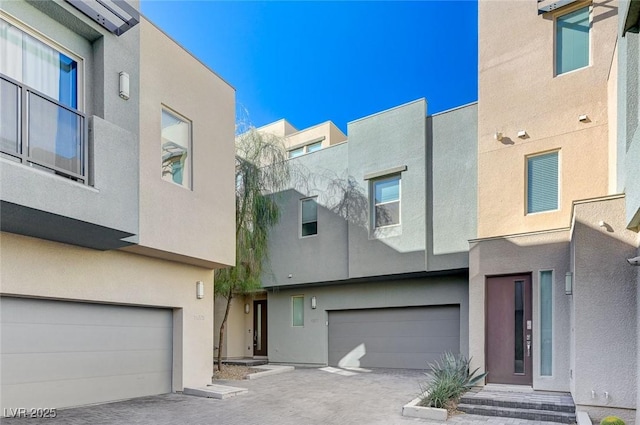 view of front facade featuring an attached garage and stucco siding