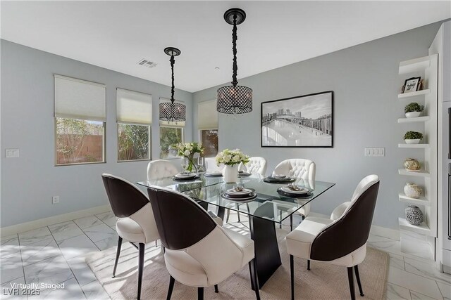 dining area featuring built in shelves