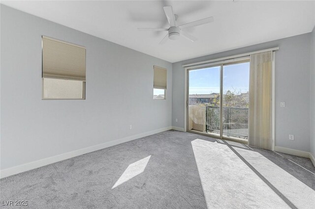 empty room featuring ceiling fan and carpet flooring