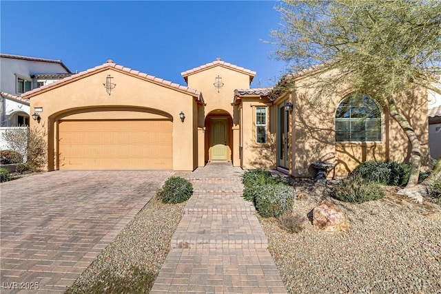 mediterranean / spanish-style house featuring a garage