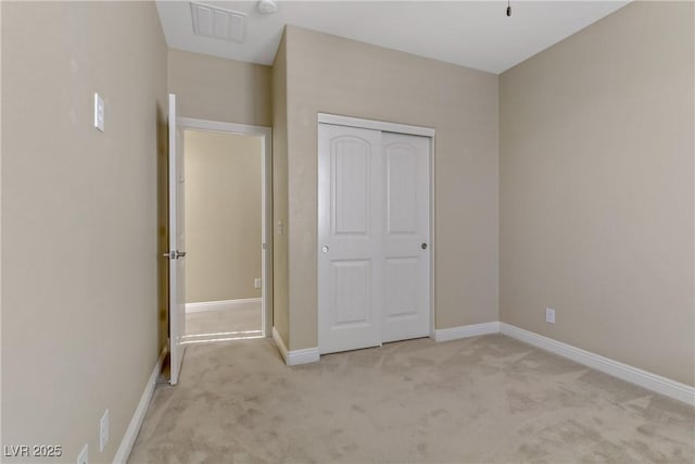 unfurnished bedroom with light carpet