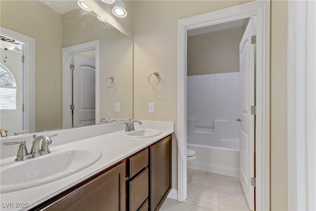 full bathroom with toilet, vanity, tile patterned flooring, and bathtub / shower combination