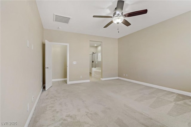 unfurnished bedroom featuring ceiling fan, connected bathroom, and light carpet