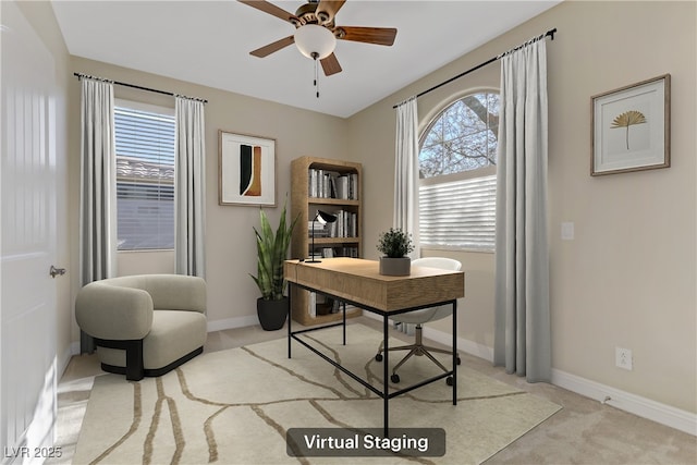 office space featuring ceiling fan and light carpet