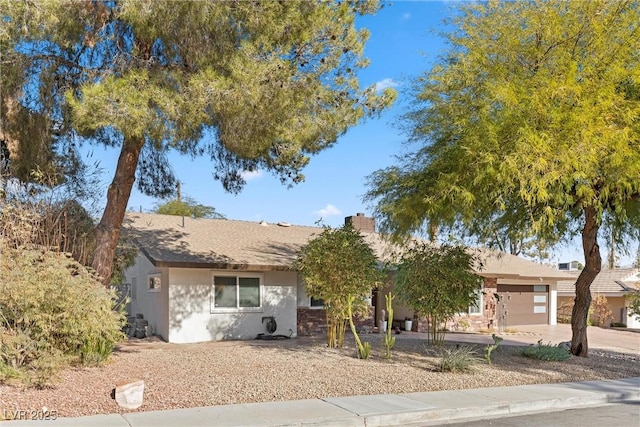 ranch-style house featuring a garage