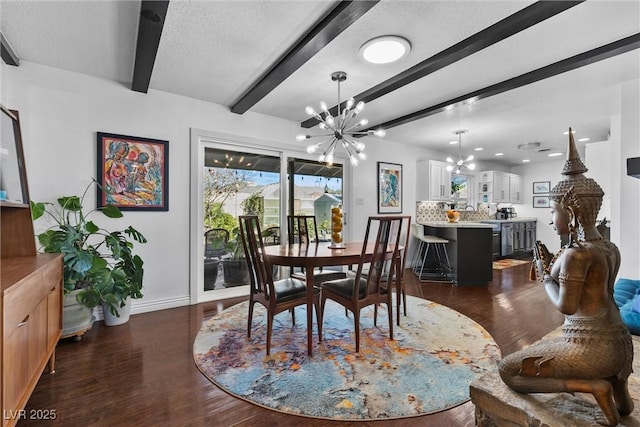 dining area featuring dark hardwood / wood-style floors, beamed ceiling, an inviting chandelier, and a textured ceiling