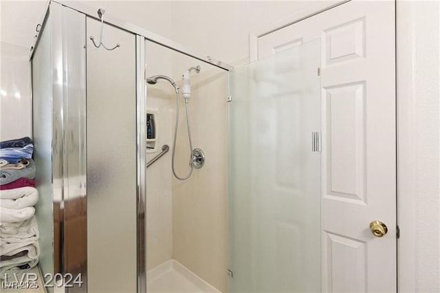 bathroom featuring an enclosed shower