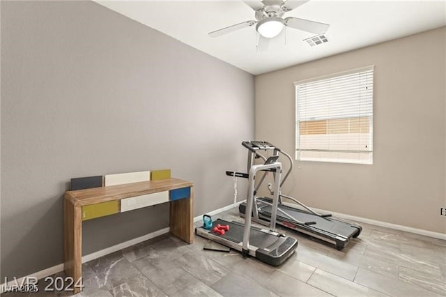 exercise room with ceiling fan