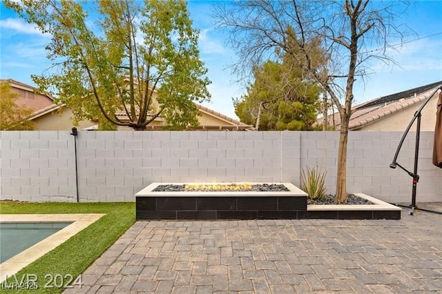 view of patio / terrace featuring a fire pit