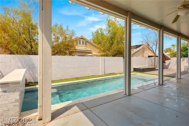 view of pool featuring ceiling fan and a patio