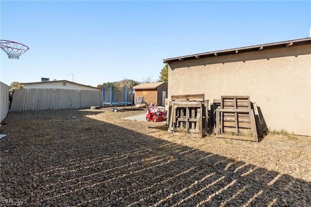 view of yard with a trampoline