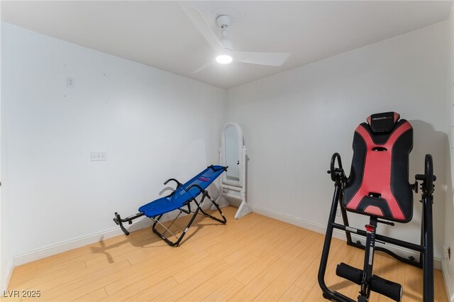 exercise area with ceiling fan and hardwood / wood-style floors