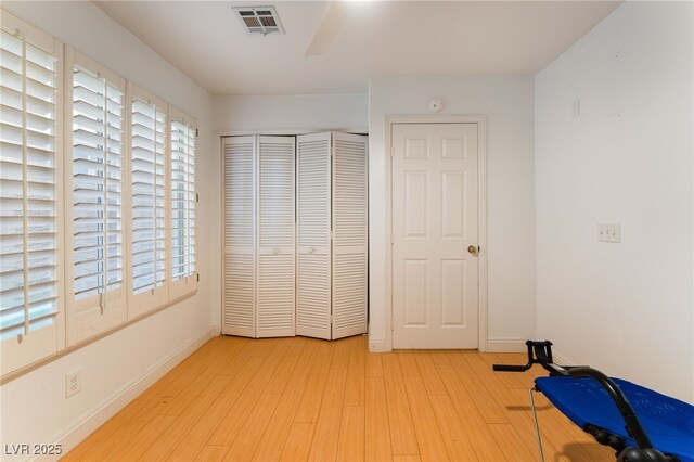 bedroom with a closet and light wood-type flooring