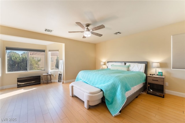 bedroom featuring ceiling fan and light wood-type flooring