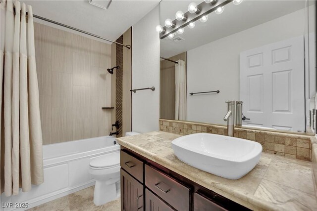 full bathroom featuring toilet, vanity, and shower / bath combo