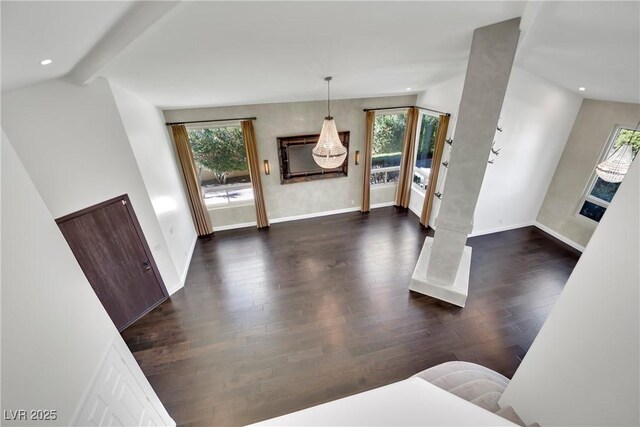 entryway featuring vaulted ceiling with beams and dark wood-type flooring