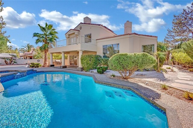 view of swimming pool with an in ground hot tub and a patio area