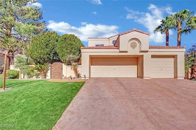 mediterranean / spanish house with a front yard and a garage