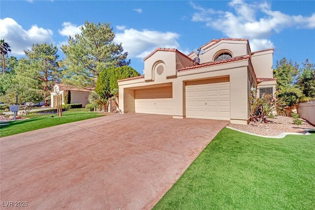 mediterranean / spanish home with a front yard