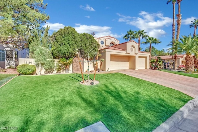 mediterranean / spanish home with a garage and a front lawn