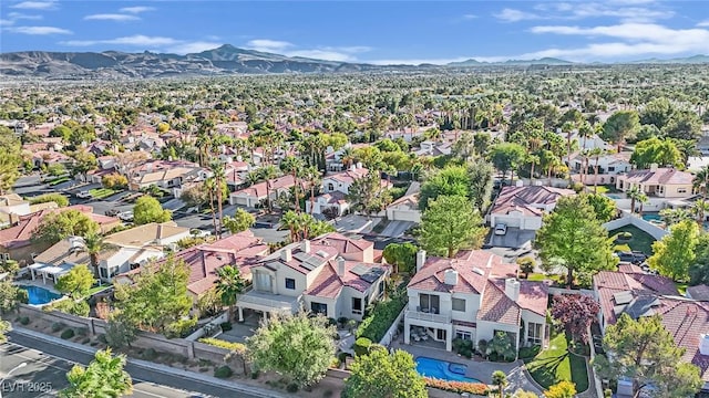 birds eye view of property with a mountain view