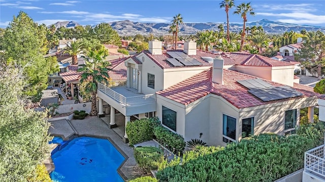 birds eye view of property featuring a mountain view