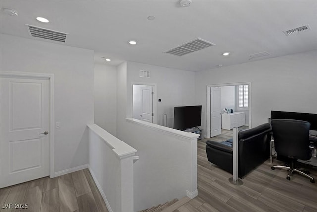 home office with wood-type flooring