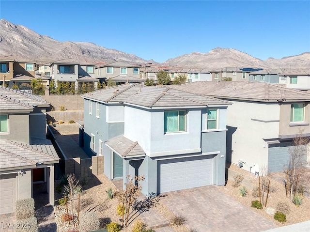 view of front of house featuring a mountain view and a garage