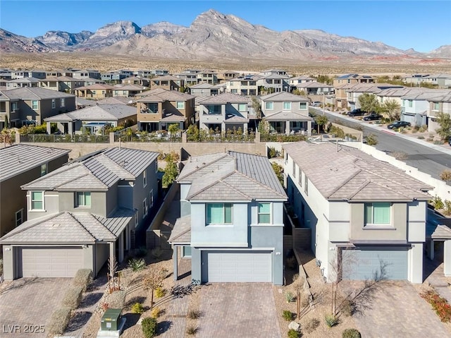 birds eye view of property with a mountain view